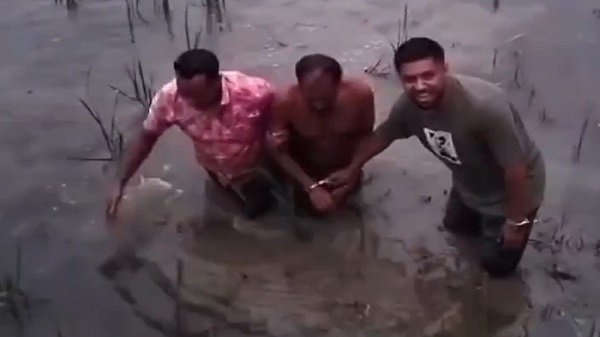 নদী পেরিয়ে নাটকীয় অভিযানে কুখ্যাত মাদক কারবারি আটক